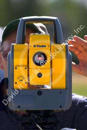 Surveyor using a laser transit in Boise, Idaho.