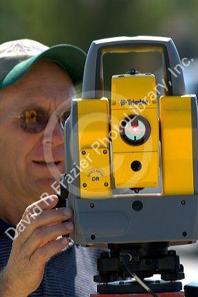 Surveyor using a laser transit in Boise, Idaho.