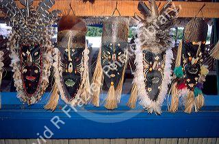 Five Amazon indian masks on display in the jungle near Manaus Brazil.