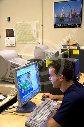 A student working on a computer at the Missouri Climate Center at the University of Missouri - Columbia.