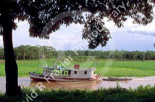 Riverboat traveling on an arm of the Amazon River near Manaus Brazil.