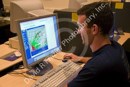 A student working on a computer in the Missouri Climate Center at the University of Missouri -  Columbia.