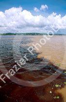 Confluence of the Rio Negro and Amazon Rivers at Manaus, Brazil.  Water temperature and chemical balance prevent mixing.