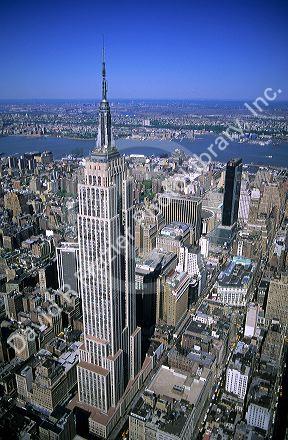 Aerial view of the Empire State Building and New York City, New York.  The Hudson River and New Jersey are in the background.
