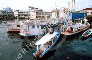Riverboats with Brazillians docked in Manaus Brazil on the Amazon River.
