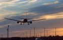 Airplane landing at sunset in Los Angelas, California at LAX airport.