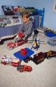 7 year old boy playing with toys in his bedroom. MR