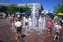 Children play in fountains at the Grove in Boise, Idaho.