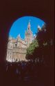 Arched view through Alcazar gate of the Giralda tower on the Cathedral in Seville, Spain.