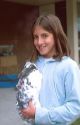 Young girl holding a pet rabbit. MR