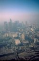 Aerial view of downtown Los Angeles shrouded in smog.