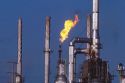 An oil refinery with gas flame.