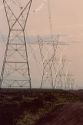 High tension electric power transmission lines cross the Idaho desert.