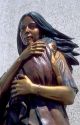 Bronze sculpture of Sacajawea indian woman holding a baby in her arms.  Located in Boise Idaho in front of the Idaho Historical Museum.  Sacajawea lead Lewis and Clark in search of a Northwest Passage.