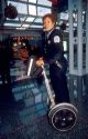 Female Chicago police officer riding a Segue gyro scooter at O'hare airport.