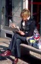 Woman reading Italian newspaper in Turin, Italy.