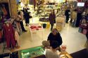 People shopping in a department store in Italy.