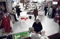 People shopping in a department store in Italy.