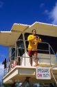 A lifeguard with binoculars in Kauai, Hawaii.  MR