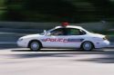 A police car in motion.
