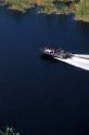 Aerial view of a bass fishing boat in the Florida Everglades.