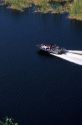 Aerial view of a bass fishing boat in the Florida Everglades.