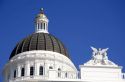 The dome and sculpture on top of the California state capitol building in Sacramento.