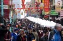 People walking and shopping in Chinatown, San Francisco, California during street festival at Chinese New Year.