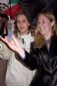 Women using a camera cell phone to take photos of the Chinese New Year Parade, Chinatown, San Francisco, California.