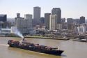 Container ship on the Mississippi River departing New Orleans, Louisiana.