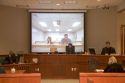 Video arraignment in criminal court in Boise, Idaho.  Defendants appear on video screen from secure jail facility while judge in courtroom conducts arraignment and sets bond.