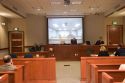 Video arraignment in criminal court in Boise, Idaho.  Defendants appear on video screen from secure jail facility while judge in courtroom conducts arraignment and sets bond.