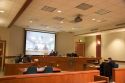 Video arraignment in criminal court in Boise, Idaho.  Defendants appear on video screen from secure jail facility while judge in courtroom conducts arraignment and sets bond.