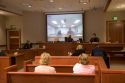 Video arraignment in criminal court in Boise, Idaho.  Defendants appear on video screen from secure jail facility while judge in courtroom conducts arraignment and sets bond.