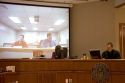 Video arraignment in criminal court in Boise, Idaho.  Defendants appear on video screen from secure jail facility while judge in courtroom conducts arraignment and sets bond.