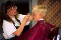 A young boy getting a haircut. MR