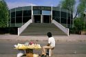 A street vendor sits in front of the Museum of Modern Art in Mexico City, Mexico.