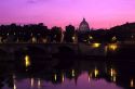 The Tiber River and St. Peters Basilica at The Vatican at sunset in Rome, Italy.