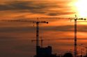 Large construction cranes at sunset in Gulfport, Mississippi.