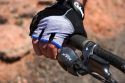 Mountain biking in the desert near Moab, Utah.  Detail of fingerless glove and handbrake.  (Model released)