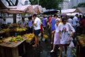 People shop at an outdoor market in Rio de Janeiro, Brazil.