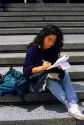 University student writing a letter in Italy.