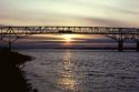A truck crosses the Umatilla Bridge made of steel trusses over the Columbia River between Oregon and Washington.