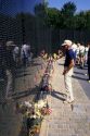 Tourists visit the Vietnam War Memorial in Washington DC.