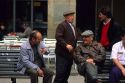 Elderly Spanish men have conversation on the streets of Barcelona, Spain.