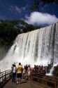 Tourists view waterfalls at Iguazu, Argentina.