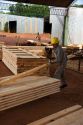 Worker sorting lumber at a lumber mill in Argentina.