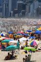 Crowded beach scene at the Copacabana Beach in Rio de Janeiro, Brazil.