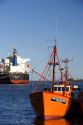 Fishing boat and grain ship at Neccochea, Argentina.