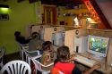 Young boys play computer games at an internet cafe  locoturio in Argentina.